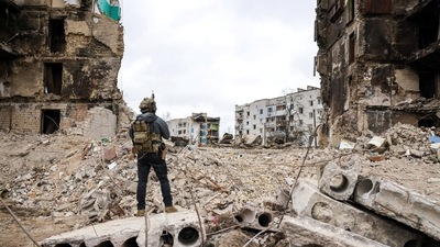 A person stands in front of destroyed buildings, during the visit of Polish President Andrzej Duda to Borodianka, as Russia's attack on Ukraine continues, in the Kyiv region, Ukraine. (REUTERS)