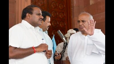 JD (S) president H D Deve Gowda with his son and party MP HD Kumaraswamy at Parliament House in New Delhi. (PTI) JD (S) president H D Deve Gowda with his son and party MP HD Kumaraswamy at Parliament House in New Delhi. (PTI)