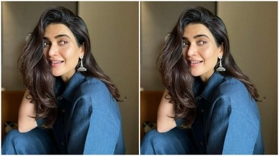 Karishma paired a half-sleeved blue shirt with a pair of blue formal cotton trousers. (Instagram/@karishmaktanna)