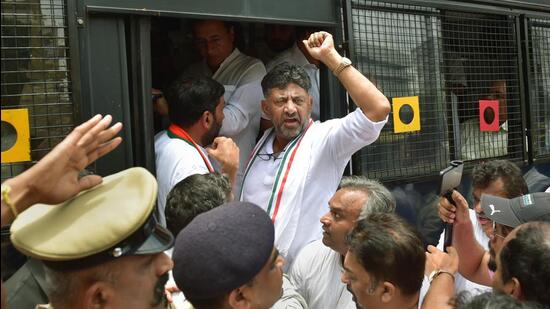 KPCC president DK Shivakumar being detained by police during a protest rally demanding the removal of KS Eshwarappa from the Karnataka government, in Bengaluru on Thursday. (PTI PHOTO.)