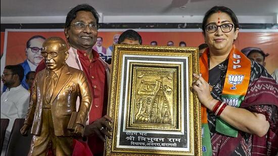Union minister Smriti Irani receives a memento on the occasion of Ambedkar Jayanti in Varanasi. (PTI PHOTO)