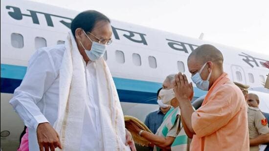 Vice President M Venkaiah Naidu being received by Uttar Pradesh chief minister Yogi Adityanath on his arrival, at the airport in Lucknow on Thursday. (ANI PHOTO)