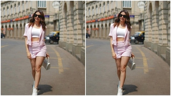Aamna paired a white tube top with a pastel pink cropped blazer and a pastel pink pair of shorts.(Instagram/@aamnasharifofficial)