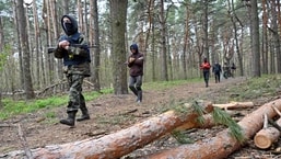 People take part in the combat training course at the recruiting center of the Ukrainian Armed Forces in Kharkiv, Ukraine.