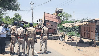 A shop belonging to an accused in the Ram Navami violence, being demolished in Khambhat on Friday. (ANI)