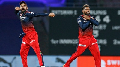 Wanindu Hasaranga and Virat Kohli of Royal Challengers Bangalore (PTI) Wanindu Hasaranga and Virat Kohli of Royal Challengers Bangalore (PTI)