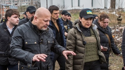 ICC Prosecutor Karim Khan and Ukraine's Prosecutor General Iryna Venediktova visit a site of a mass grave in the town of Bucha, outside Kyiv. (Reuters)