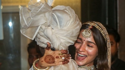 Ranbir Kapoor and Alia Bhatt after their wedding ceremony, outside their residence, in Mumbai. (PTI) Ranbir Kapoor and Alia Bhatt after their wedding ceremony, outside their residence, in Mumbai. (PTI)