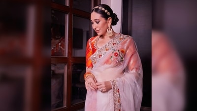 Karisma Kapoor paired her 6 yards with a contrasting orange brocade blouse. (Instagram/@manishmalhotraworld) Karisma Kapoor paired her 6 yards with a contrasting orange brocade blouse. (Instagram/@manishmalhotraworld)