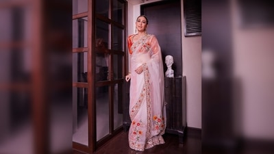 Designer Manish Malhotra shared Karisma Kapoor's pictures on his official Instagram handle and captioned the post, "The remarkably beautiful @therealkarismakapoor in our sheer ivory organza #mymmsaree, from our #Khaab collection, hand-embroidered in classic zari, floral motifs paired with a contrasting brocade coord set for #RanbirKapoor and #AliaBhatt’s wedding.." (Instagram/@manishmalhotraworld) Designer Manish Malhotra shared Karisma Kapoor's pictures on his official Instagram handle and captioned the post, "The remarkably beautiful @therealkarismakapoor in our sheer ivory organza #mymmsaree, from our #Khaab collection, hand-embroidered in classic zari, floral motifs paired with a contrasting brocade coord set for #RanbirKapoor and #AliaBhatt’s wedding.." (Instagram/@manishmalhotraworld)