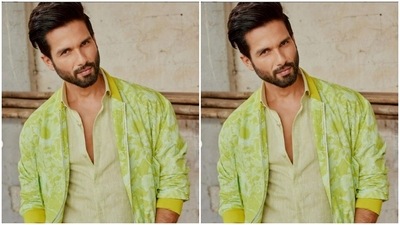 Shahid paired a yellow cotton shirt with a soft green tie and dye printed bomber jacket. He layered his look with a pair of blue denims. (Instagram/@shahidkapoor)