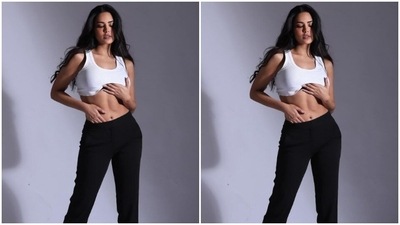 Esha paired a white sleeveless cropped top with a pair of black high-waisted trousers. (Instagram/@egupta)