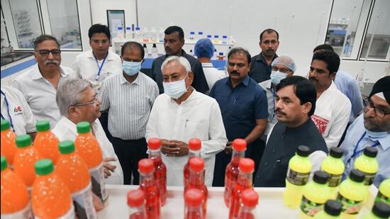 Bihar’s chief minister Nitish Kumar and industry minister Shahnawaz Hussain visit Pepsi bottling plant after its inauguration in Begusarai district on Friday. (PTI)