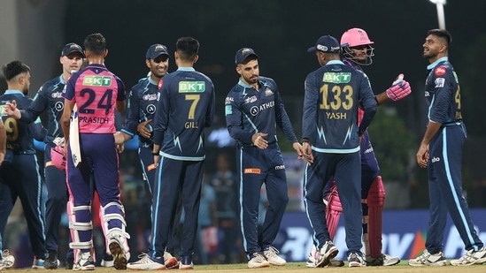Players exchange greetings after Gujarat Titans won the Indian Premier League 2022 match against Rajasthan Royals(PTI)