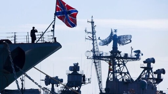FILE - A Russian sailor salutes on the bow of Missile Cruiser Moskva, left, as crew of Russian patrol ship Pitliviy, right, prepare to moor the vessel, in Sevastopol, Crimea, (AP) FILE - A Russian sailor salutes on the bow of Missile Cruiser Moskva, left, as crew of Russian patrol ship Pitliviy, right, prepare to moor the vessel, in Sevastopol, Crimea, (AP)