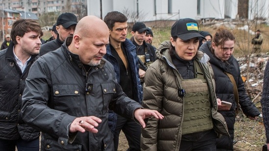 ICC Prosecutor Karim Khan and Ukraine's Prosecutor General Iryna Venediktova visit a site of a mass grave in the town of Bucha, outside Kyiv.(Reuters)