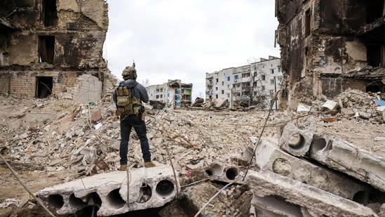 A person stands in front of destroyed buildings, during the visit of Polish President Andrzej Duda to Borodianka, as Russia's attack on Ukraine continues, in the Kyiv region, Ukraine.