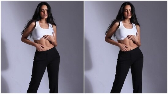 Esha paired a white sleeveless cropped top with a pair of black high-waisted trousers.(Instagram/@egupta)