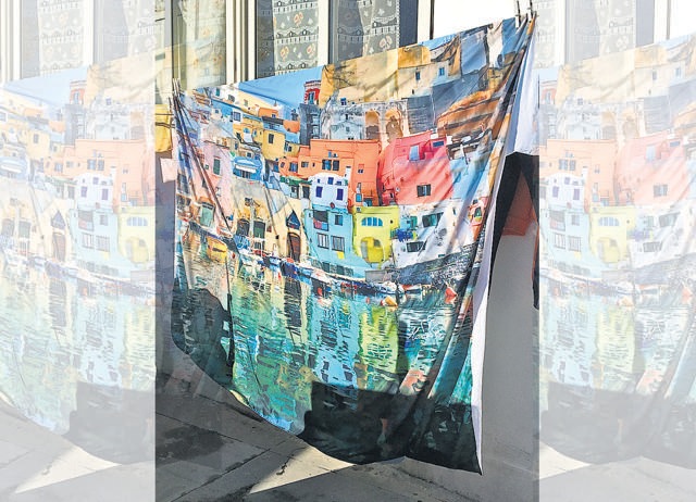 The island’s houses painted on a tablecloth The island’s houses painted on a tablecloth