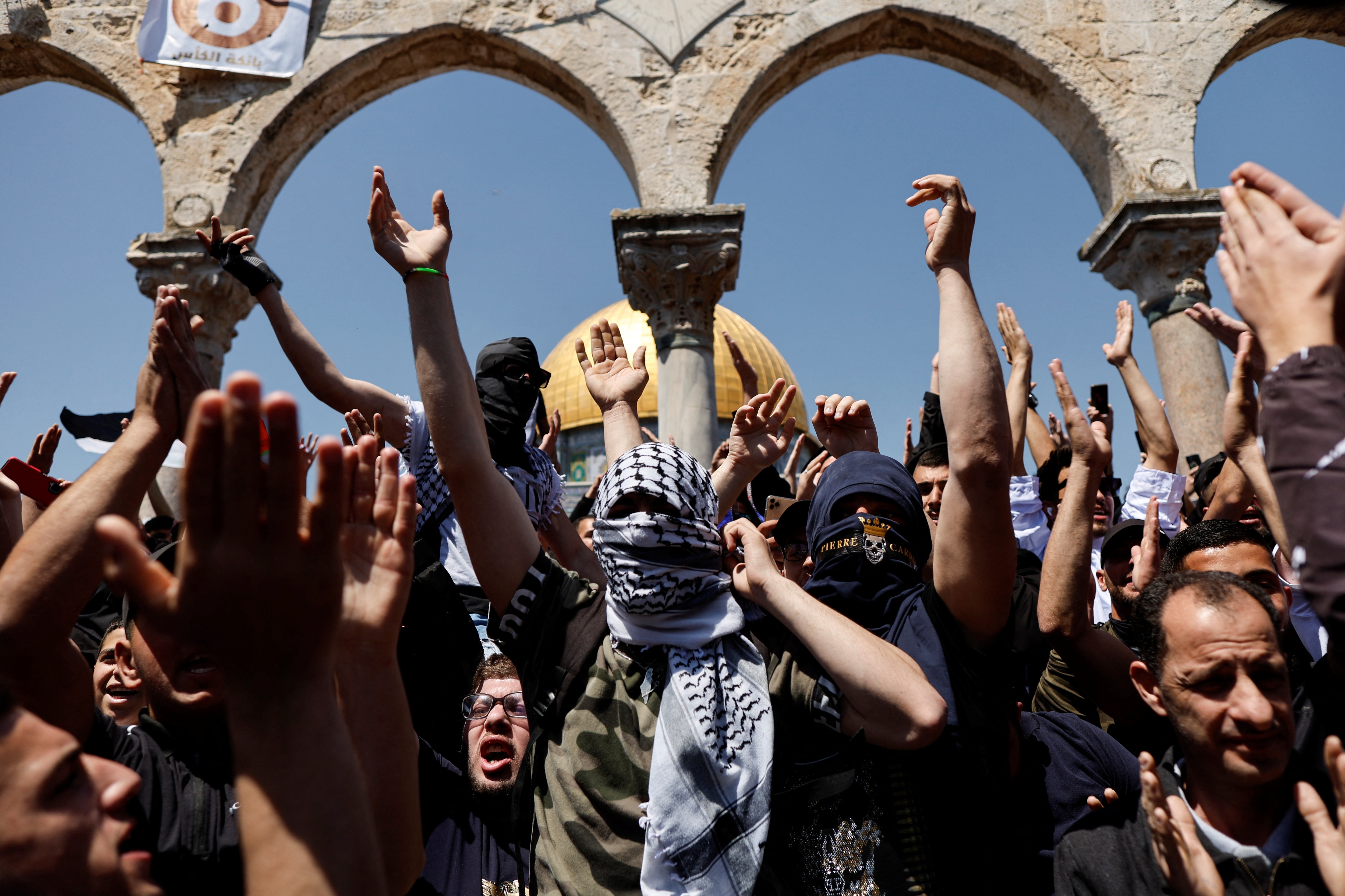 Palestinians shout slogans at the compound that houses Al-Aqsa Mosque, following clashes with Israeli security forces in Jerusalem's Old City on April 15, 2022.&nbsp; (REUTERS)