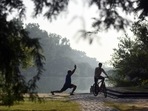 A man performs yoga on a hazy morning at Sanjay Lake in New Delhi.(Hindustan Times) A man performs yoga on a hazy morning at Sanjay Lake in New Delhi.(Hindustan Times)