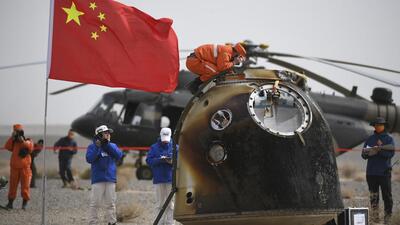 The return capsule of the Shenzhou-13 manned space mission is seen after landing at the Dongfeng landing site in northern China’s Inner Mongolia Autonomous Region, on Saturday. (AP)