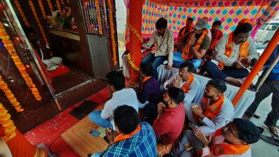 Thane, India - April 16, 2022: Maharashtra Navnirman Sena (MNS) workers read Hanuman Chalisa on the occasion of Hanuman Jayanti at Hanuman Temple, Teen Petrol Pump area, in Thane, Mumbai, India, on Saturday, April 16, 2022. (Praful Gangurde/HT Photo) (HT PHOTO) Thane, India - April 16, 2022: Maharashtra Navnirman Sena (MNS) workers read Hanuman Chalisa on the occasion of Hanuman Jayanti at Hanuman Temple, Teen Petrol Pump area, in Thane, Mumbai, India, on Saturday, April 16, 2022. (Praful Gangurde/HT Photo) (HT PHOTO)