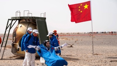 In this photo released by China's Xinhua News Agency, Chinese astronaut Ye Guangfu sits outside return capsule of the Shenzhou-13 manned space mission after landing at the Dongfeng landing site in northern China's Inner Mongolia Autonomous Region, Saturday. (AP) In this photo released by China's Xinhua News Agency, Chinese astronaut Ye Guangfu sits outside return capsule of the Shenzhou-13 manned space mission after landing at the Dongfeng landing site in northern China's Inner Mongolia Autonomous Region, Saturday. (AP)