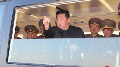 North Korean leader Kim Jong Un gestures as he watches the test-firing of a new-type tactical guided weapon according to state media, North Korea. (REUTERS)