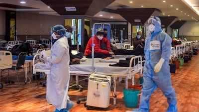 Covid-19 patients undergo treatment inside the Shehnai Banquet Hall, a Covid-19 care facility, in New Delhi. (PTI)