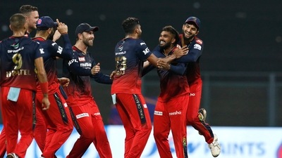 Mumbai: Wanindu Hasaranga of Royal Challengers Bangalore celebrates the wicket of David Warner of Delhi Capitals during the Indian Premier League 2022 cricket match between Delhi Capitals and Royal Challengers Bangalore, at the Wankhede Stadium, in Mumbai, Saturday, April 16, 2022. (Sportzpics/PTI Photo) (PTI04_16_2022_000323B) (PTI) Mumbai: Wanindu Hasaranga of Royal Challengers Bangalore celebrates the wicket of David Warner of Delhi Capitals during the Indian Premier League 2022 cricket match between Delhi Capitals and Royal Challengers Bangalore, at the Wankhede Stadium, in Mumbai, Saturday, April 16, 2022. (Sportzpics/PTI Photo) (PTI04_16_2022_000323B) (PTI)