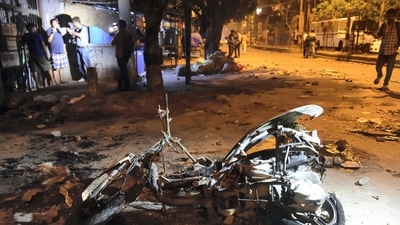 Charred remains of a scooter after violent clashes during a Hanuman Jayanti procession at Jahangirpuri, in New Delhi. (PTI)