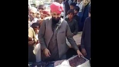 Parlat Singh, a resident of Tirah valley , distributing Ramadan food packets.
