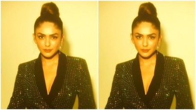 Mrunal opted for a minimal makeup look with the outfit. In nude eyeshadow, black eyeliner, mascara-laden eyelashes, drawn eyebrows, contoured cheeks and a shade of nude lipstick, Mrunal looked ready to party. (Instagram/@mrunalthakur)