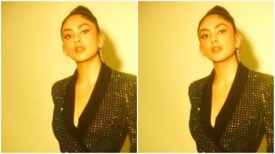 Styled by Sheefa J Gilani, Mrunal wore her tresses into a clean top bun as she posed for the pictures. (Instagram/@mrunalthakur)