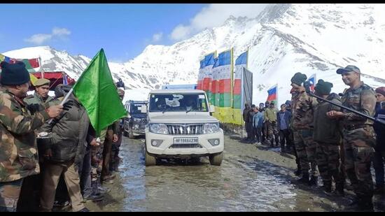 Border Roads Organisation DG Lt Gen Rajeev Chaudhary flags off vehicles after restoration of the Shinkula Pass, connecting Leh-Ladakh’s Zanskar valley with Lahaul, in Himachal Pradesh, on Saturday. (PTI)