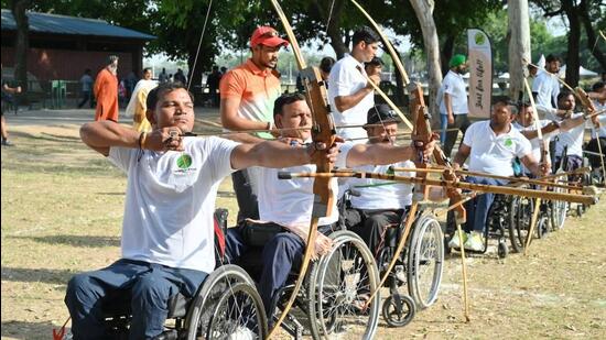 Participants in action during the archery rounds of the Sports Carnival for wheelchair athletes. (HT Photo)