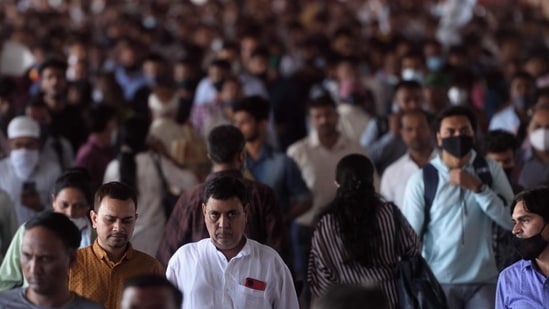 Commuters seen without masks on a crowded railway bridge at Dadar staion, in Mumbai, India. (Photo by Satish Bate/Hindustan Times)