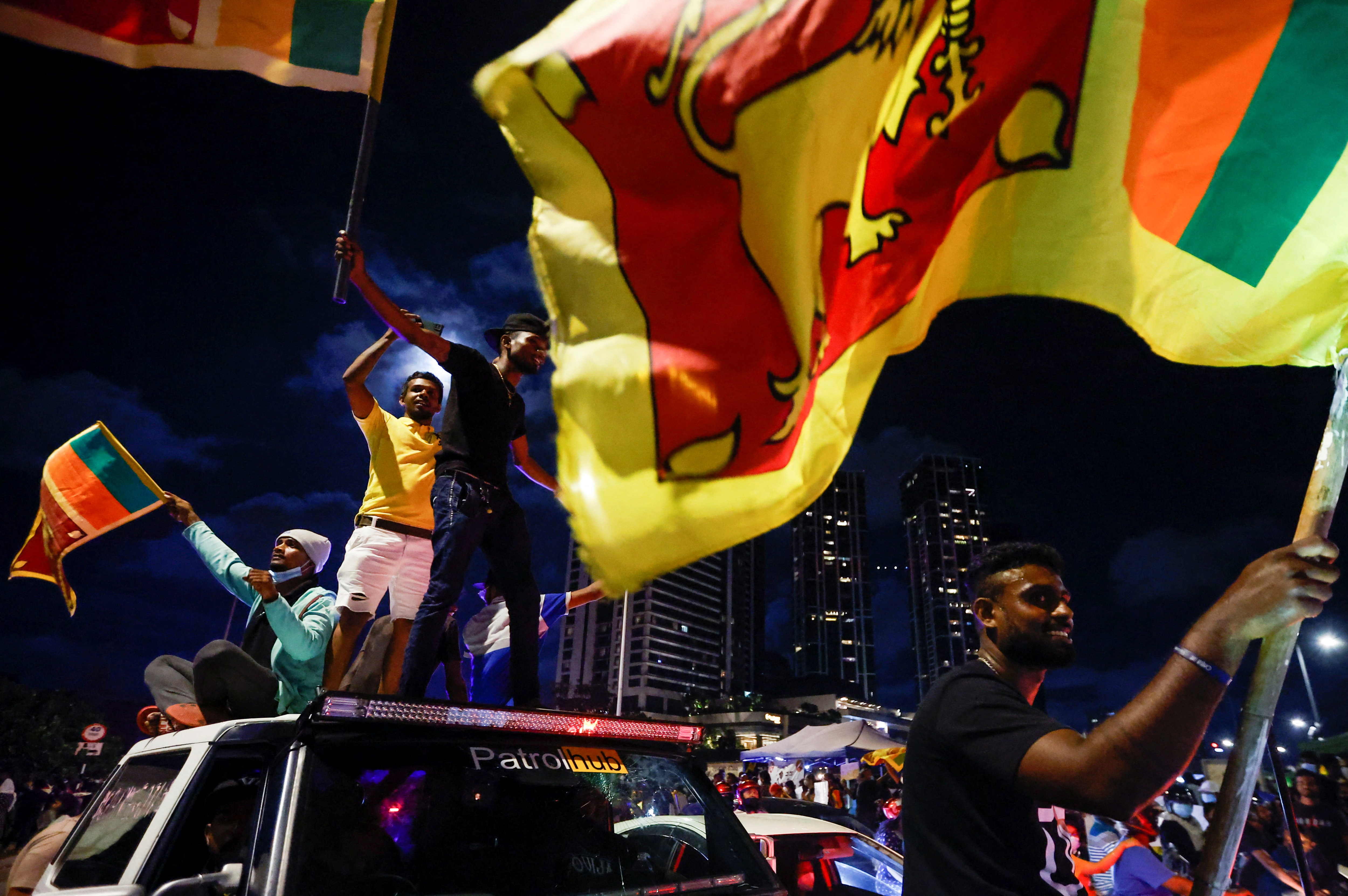 Demonstrators hold Sri Lankan national flags and shout slogans during a protest against Sri Lankan President Gotabaya Rajapaksa, near the Presidential Secretariat in Colombo, Sri Lanka. (REUTERS)
