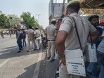 New Delhi: Security personnel stand guard after clashes broke out between two communities during a Hanuman Jayanti procession on Saturday, at Jahangirpuri in New Delhi, Sunday, April 17, 2022. (PTI Photo/Shahbaz Khan)(PTI04_17_2022_000017A)
