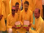 Rajkot: Guests at a wedding pose for camera as they gift lemons to the groom. Rajkot: Guests at a wedding pose for camera as they gift lemons to the groom.
