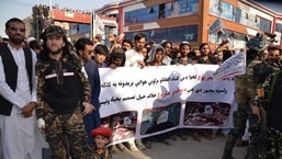 Demonstrators hold a banner during a protest against Pakistani airstrikes, in Khost on Friday.