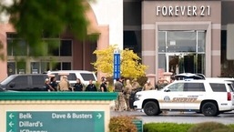 Members of law enforcement gather outside Columbiana Centre mall in Columbia, S.C., following a shooting, April 16, 2022.