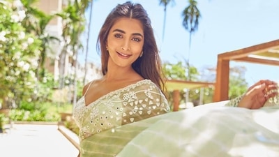 Pooja Hegde cuts romantic, flirtatious silhouette in backless sheer green saree (Instagram/hegdepooja) Pooja Hegde cuts romantic, flirtatious silhouette in backless sheer green saree (Instagram/hegdepooja)