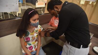 A beneficiary of age group 12-14 taking Covid vaccine at Kamala Nehru hospital in Pune. (HT FILE) A beneficiary of age group 12-14 taking Covid vaccine at Kamala Nehru hospital in Pune. (HT FILE)