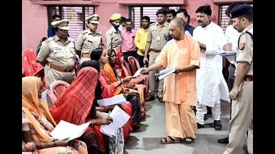 Chief minister Yogi Adityanath listening to the grievances of the people during the Janata Darshan programme, at Hindu Seva Ashram, Gorakhnath temple, in Gorakhpur on Sunday. (AGENCY) Chief minister Yogi Adityanath listening to the grievances of the people during the Janata Darshan programme, at Hindu Seva Ashram, Gorakhnath temple, in Gorakhpur on Sunday. (AGENCY)