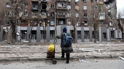 Mariupol: A local resident looks at a damaged apartment building near the Illich Iron &amp; Steel Works Metallurgical Plant. (AP)