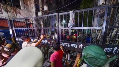 Police personnel try to control the situation after violent clashes broke out during a Hanuman Jayanti procession at Jahangirpuri, in New Delhi. (PTI) Police personnel try to control the situation after violent clashes broke out during a Hanuman Jayanti procession at Jahangirpuri, in New Delhi. (PTI)