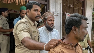 Hubballi: Security personnel detain people after incidents of stone throwing in some areas of Old Hubballi late on Saturday evening, in Hubballi district, Sunday, April 17, 2022. (PTI Photo) (PTI) Hubballi: Security personnel detain people after incidents of stone throwing in some areas of Old Hubballi late on Saturday evening, in Hubballi district, Sunday, April 17, 2022. (PTI Photo) (PTI)