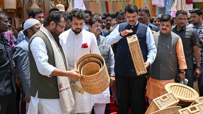 Union ministers Anurag Thakur and Mukhtar Abbas Naqvi with former Maharashtra CM Devendra Fadnavis at a stall during the inauguration of 'Hunar Haat' in Mumbai. (PTI) Union ministers Anurag Thakur and Mukhtar Abbas Naqvi with former Maharashtra CM Devendra Fadnavis at a stall during the inauguration of 'Hunar Haat' in Mumbai. (PTI)